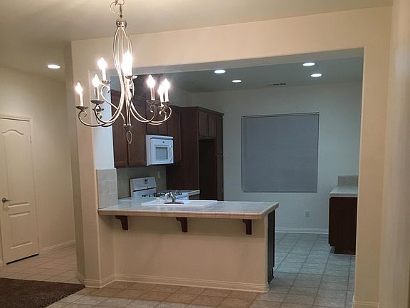 Kitchen includes stove, microwave and dishwasher