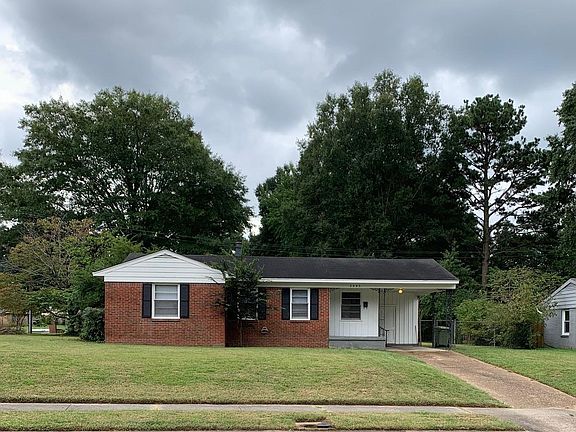 The neighbors driveway is on the other side of their house which provides a lot of privacy. The front door is off the porch. There is also an entrance into the kitchen from the carport.