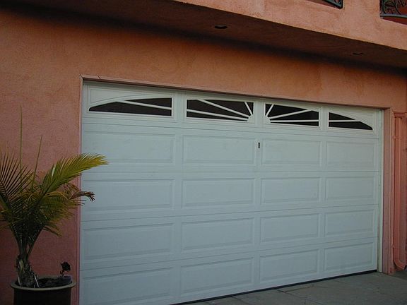2 car garage w/ remote opener - plenty of storage space insi