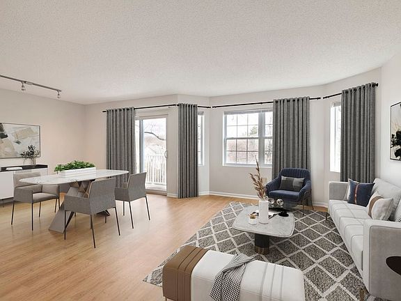 Renovated Package I living and dining room with hard surface flooring