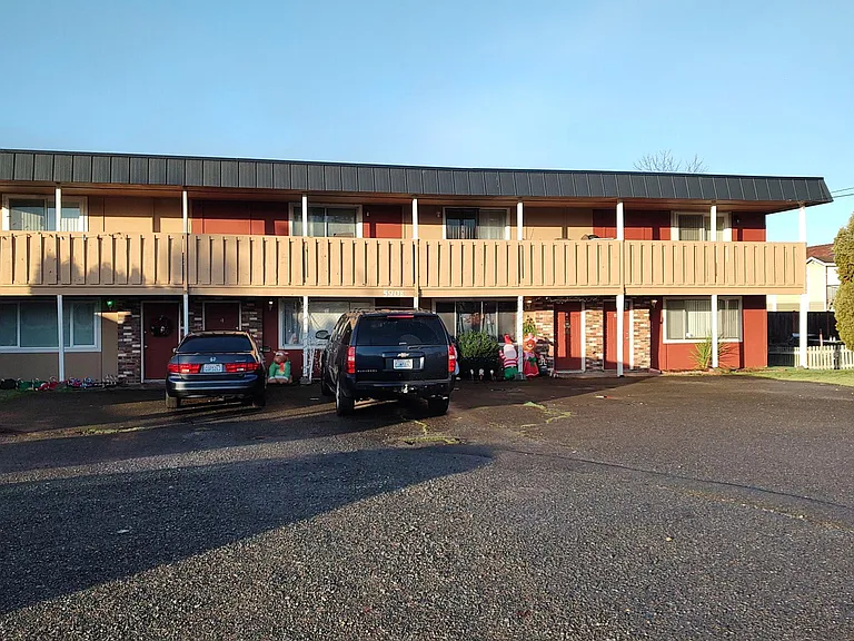 Unit D is the RH end of the building. There is adequate off-street parking provided.