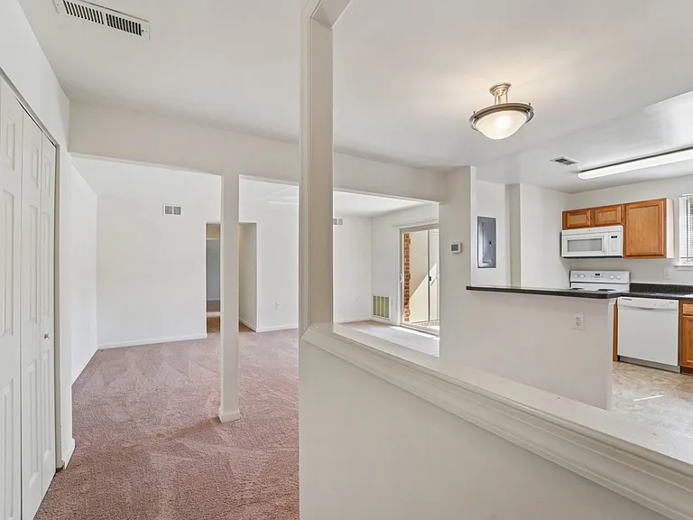 2BR, 1.5BA - 939SF - Vacant - Foyer, Coat Close, Living Room and Kitchen