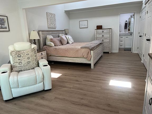 Master bedroom and sitting room. Furnishings may vary.