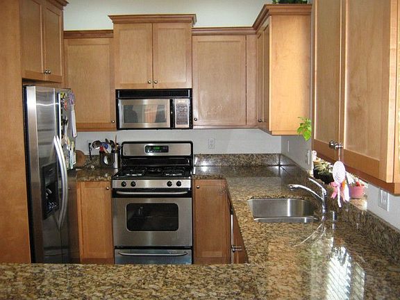 Gourmet kitchen with stainless steel appliances and granite counters.
