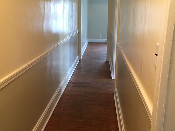 The hallway leading to the family room and bedroom.