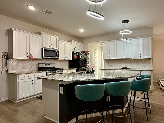 Kitchen with an island and plenty of cabinet space