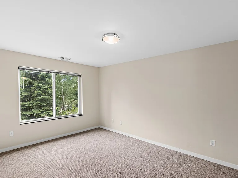 Elevate your lifestyle at Overlook Ridge with this spacious, light-filled room featuring large windows and serene views. Perfect for creating your ideal living space. Explore your new home today!