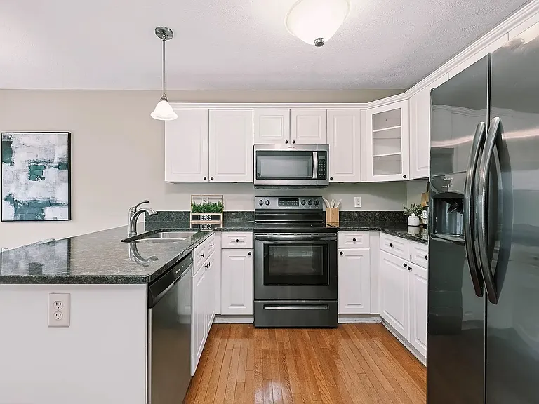 Kitchen and dining area. All appliances are included. Furniture is for illustrative purposes only.