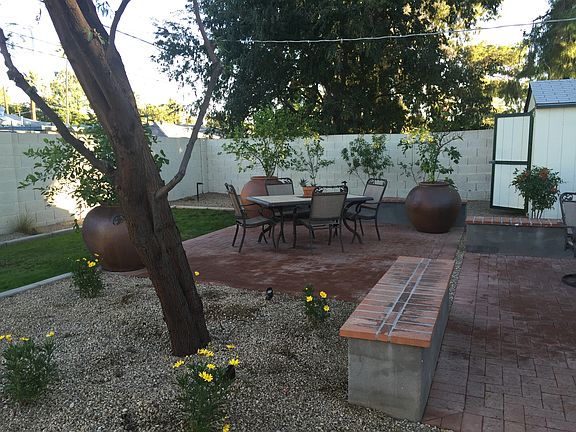 Back yard grass/brick patio 