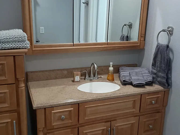 Two of three vanities. Mirrors open.