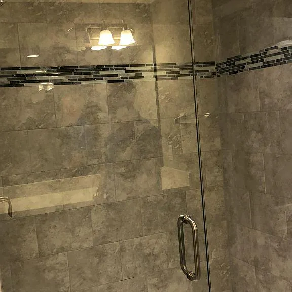 Upgraded master shower with frameless doors