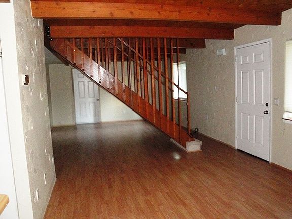 View of Dining & Living area w/stairway.