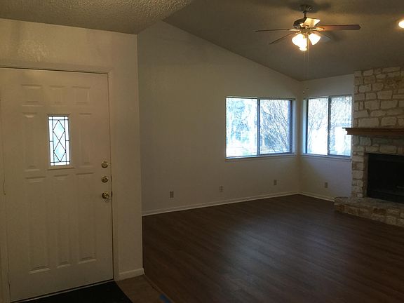 Front entry, living room, vaulted ceiling, corner windows.