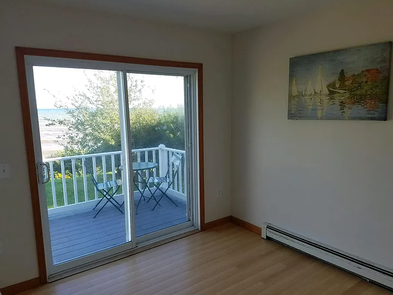 Bedroom with sliding Doors to Lakeside Deck