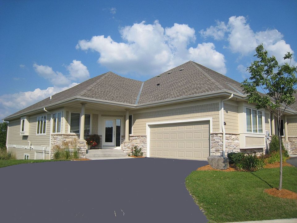 Exceptional Walk-Out Rambler with private view of expansive natural spaces.