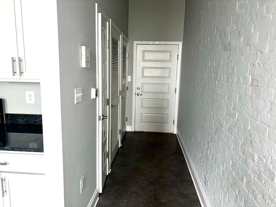 Front door hallway with washer dryer and utility closet