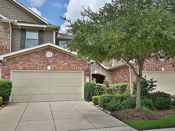 TWO CAR GARAGE: Thegarage and double wide driveway are key features of this town home. This town home is one of a few in Lakewood Place that offers a two car garage.