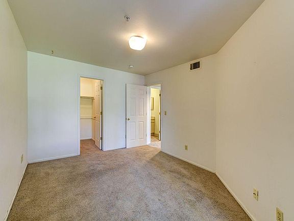 Bedroom with walk-in closet