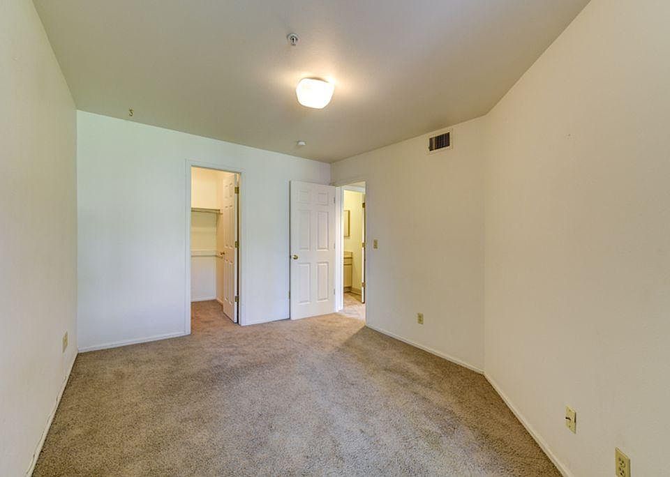 Bedroom with walk-in closet