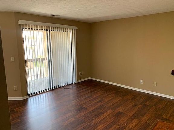 Living room with sliding glass door to balcony