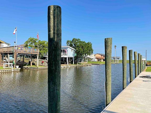 relaxing canal view from the second lot/side yard.