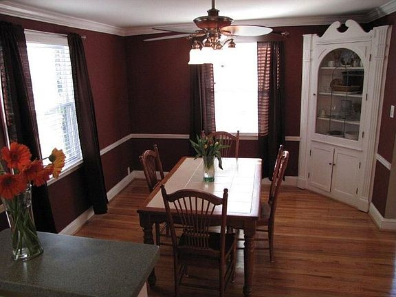 Formal dining highlighted with original built-in china cabinet