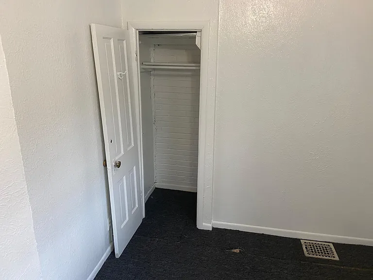 Back bedroom closet from across the entrance
