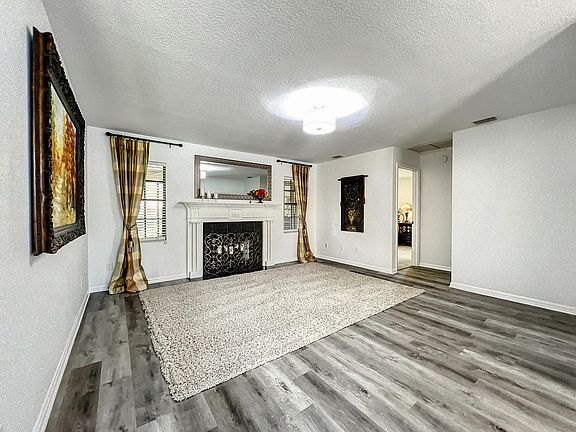Living room with decorative fireplace.