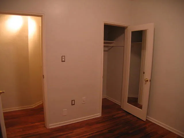 Bedrooms are improved with mirrored entry and closet doors lighting is set up on dimmer