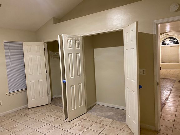 Master Bedroom w/ double closets high ceiling.