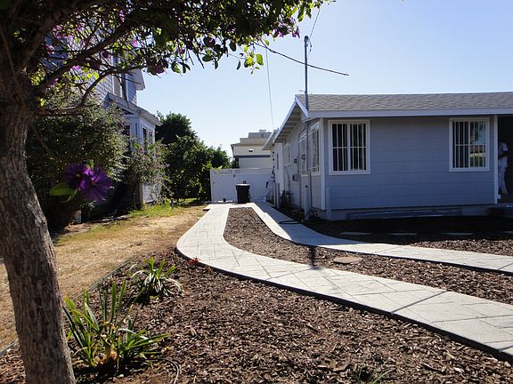 parking pad and entry to back house