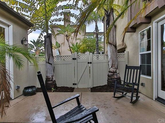 Courtyard which has French doors leading to the downstairs bedroom/office, dining/kitchen area, and formal dining/living area