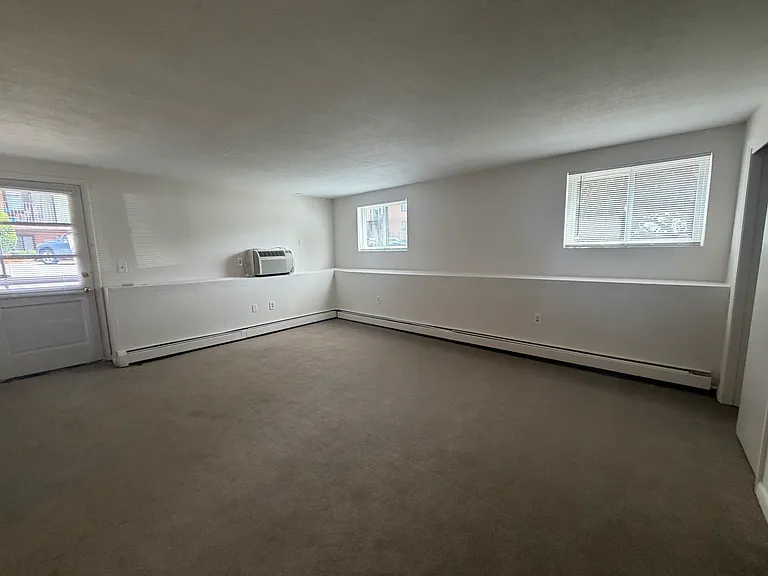 Nice sized living room with new carpeting
