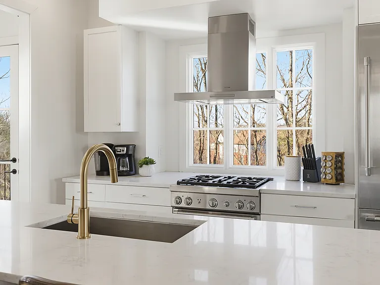 Fully equipped kitchen with stainless steel appliances, seating for 4 at the kitchen island, additional seating at the dining room table and all the dishware / utensils you might need.