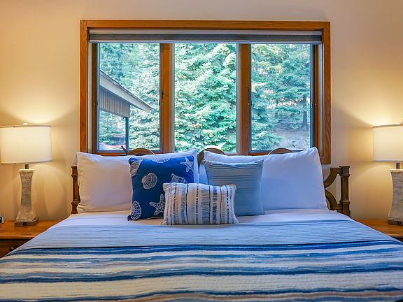 Main bedroom closest to upstairs bathroom with king sized bed.