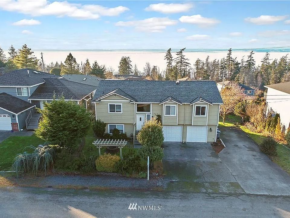 Front of house - two car garage and level parking