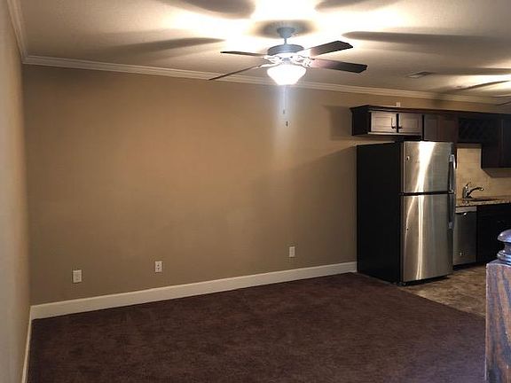 Great Room Carpeted Open to Kitchen Dining