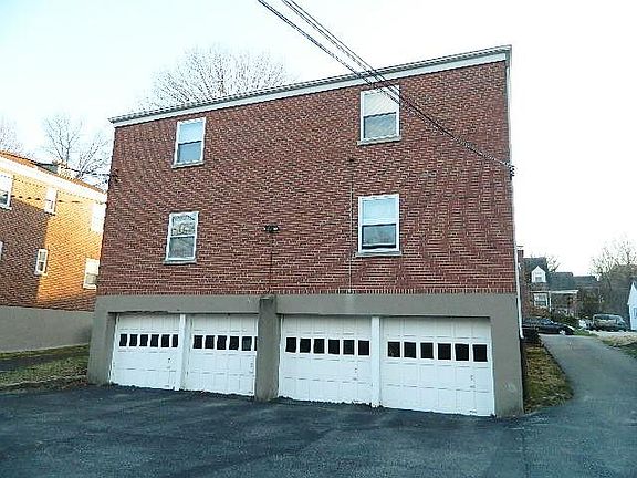 A 1 car garage for each apartment with electric opener