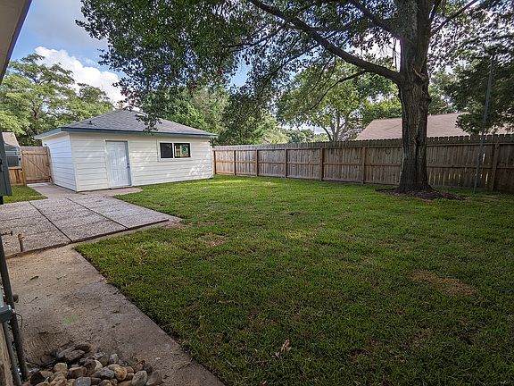 Backyard with detached 400 sqft shop/storage building