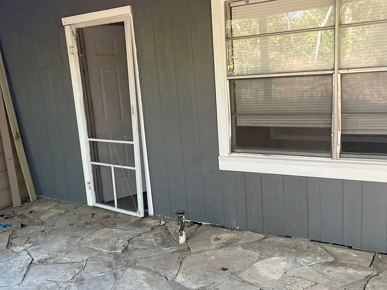 Stone covered patio off 2nd bedroom