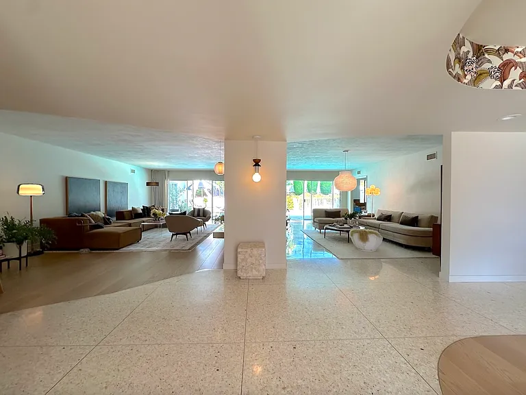 entryway opens to 2 separate living rooms