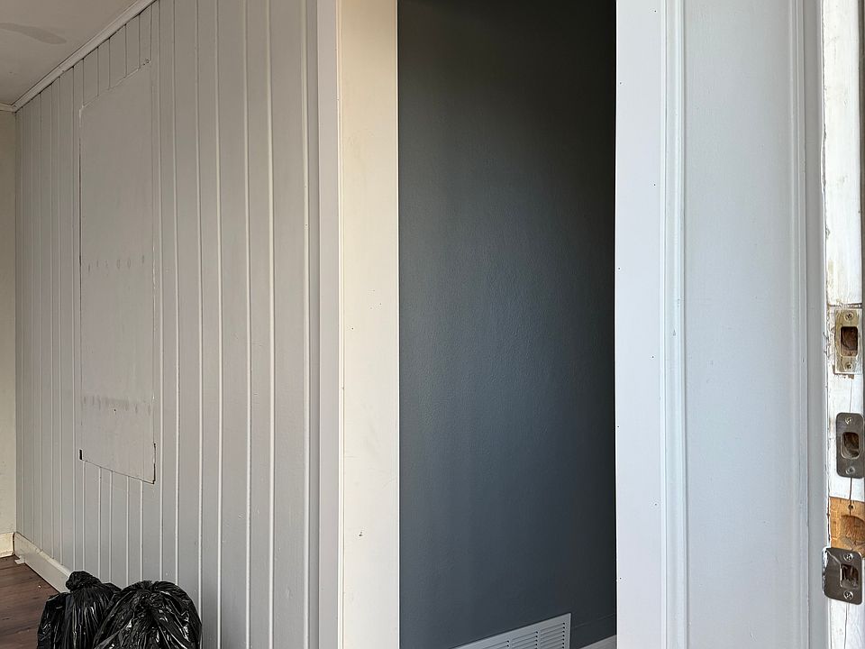 front room with brown flooring (right when you walk in the house). this room has no closet but would make a decent sized bedroom. i could add an interior door if needed or it can be left open like in the picture, it connects to living room