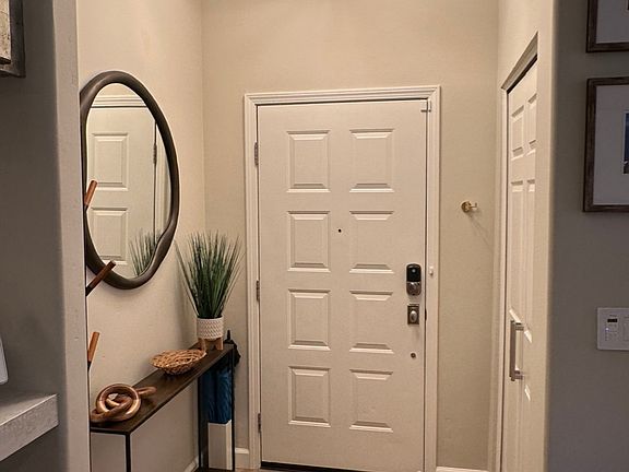 View of entrance I just described in previous picture - coat closet to your right and console table and mirror to your left when facing this direction.