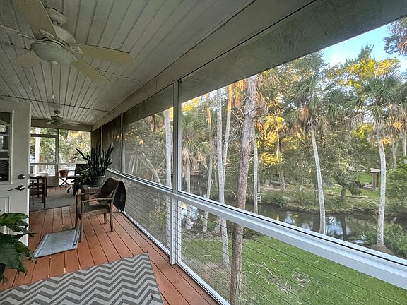 Relax and appreciate the views on this large screened in upper deck.