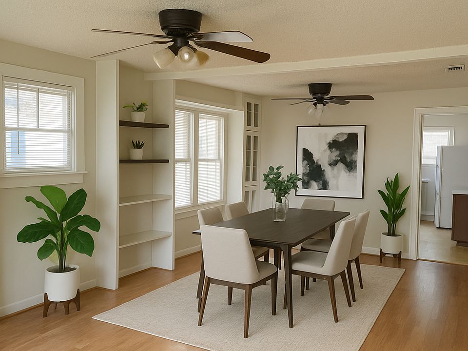 Great dining area with cabinets for display or storage. Furniture is staged
