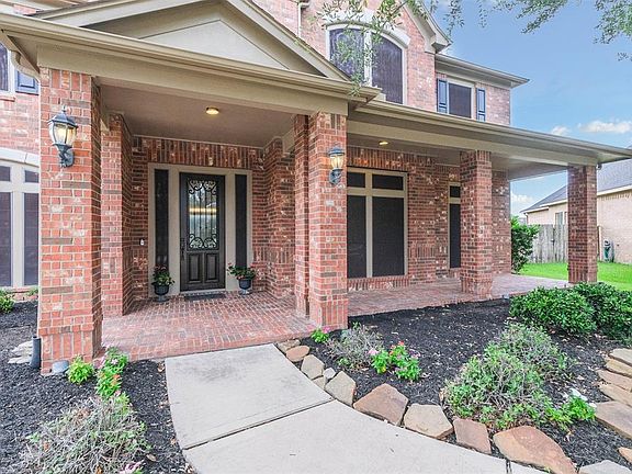 A Large Front Porch is just waiting for some rocking chairs to sit and wave to the neighbors from.