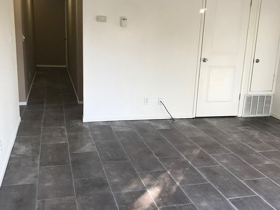 Living room, hallway and walk in storage closet