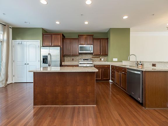 Hardwood floors, stainless steel appliances, huge island and a pantry!