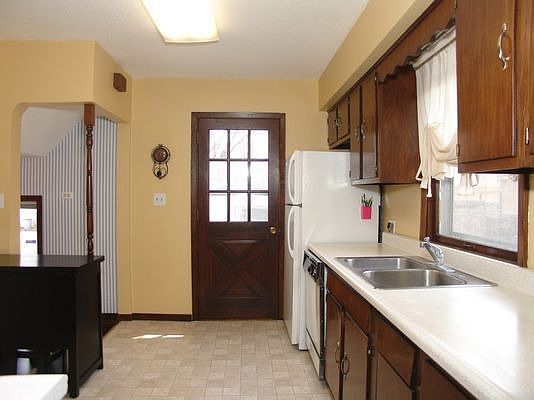 Nice clean kitchen area with an area for a small table and chairs