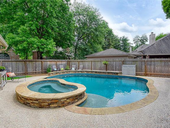 The cool pool is ready for summer fun! For added safety, the pool area can be closed off with a metal security gate outside the back door of the house.